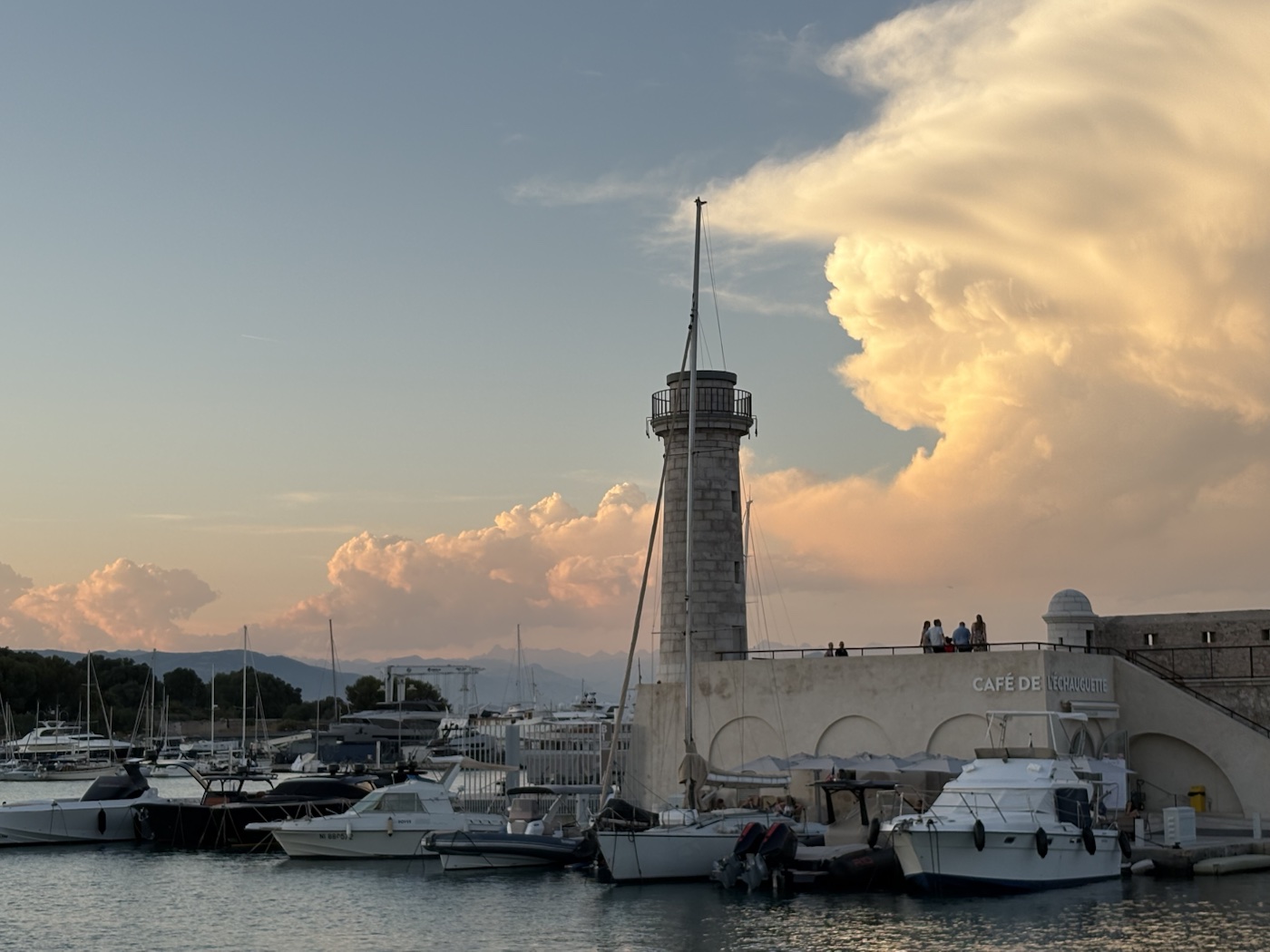 Antibes harbour and lighthouse in evening light
