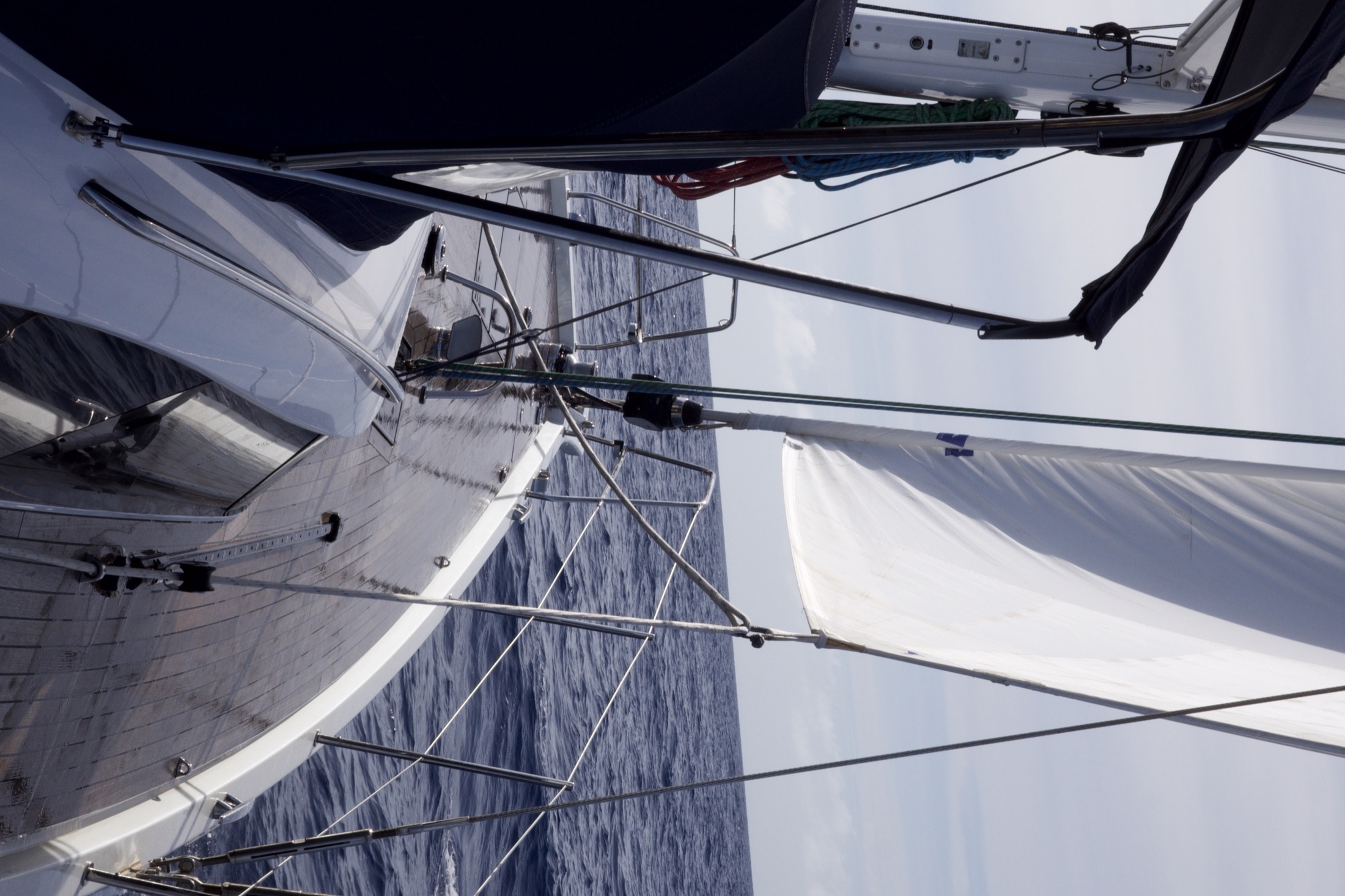 View forward along the deck of a sailing yacht during an offshore passage